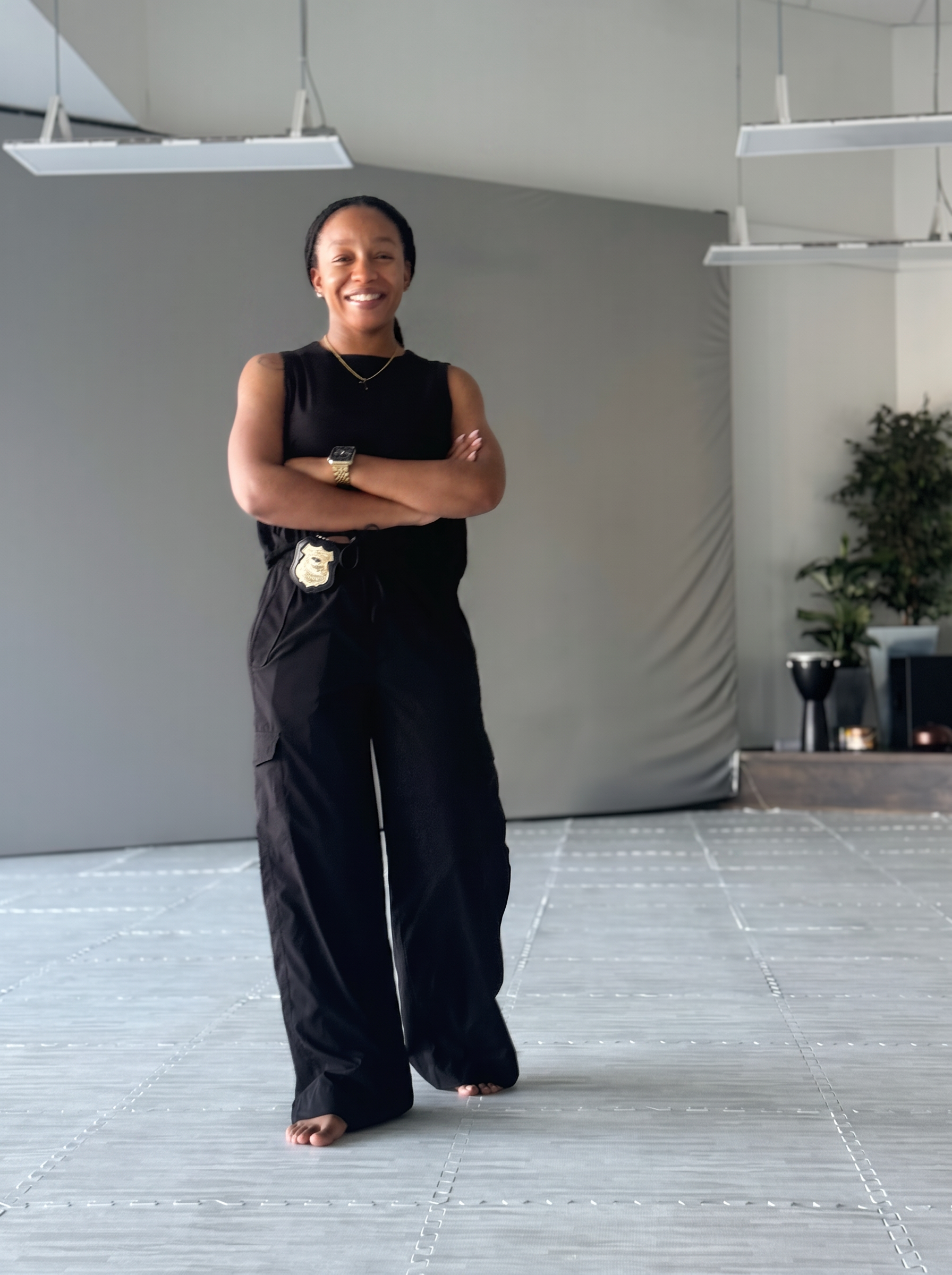Tierra Banks in a studio, reflective